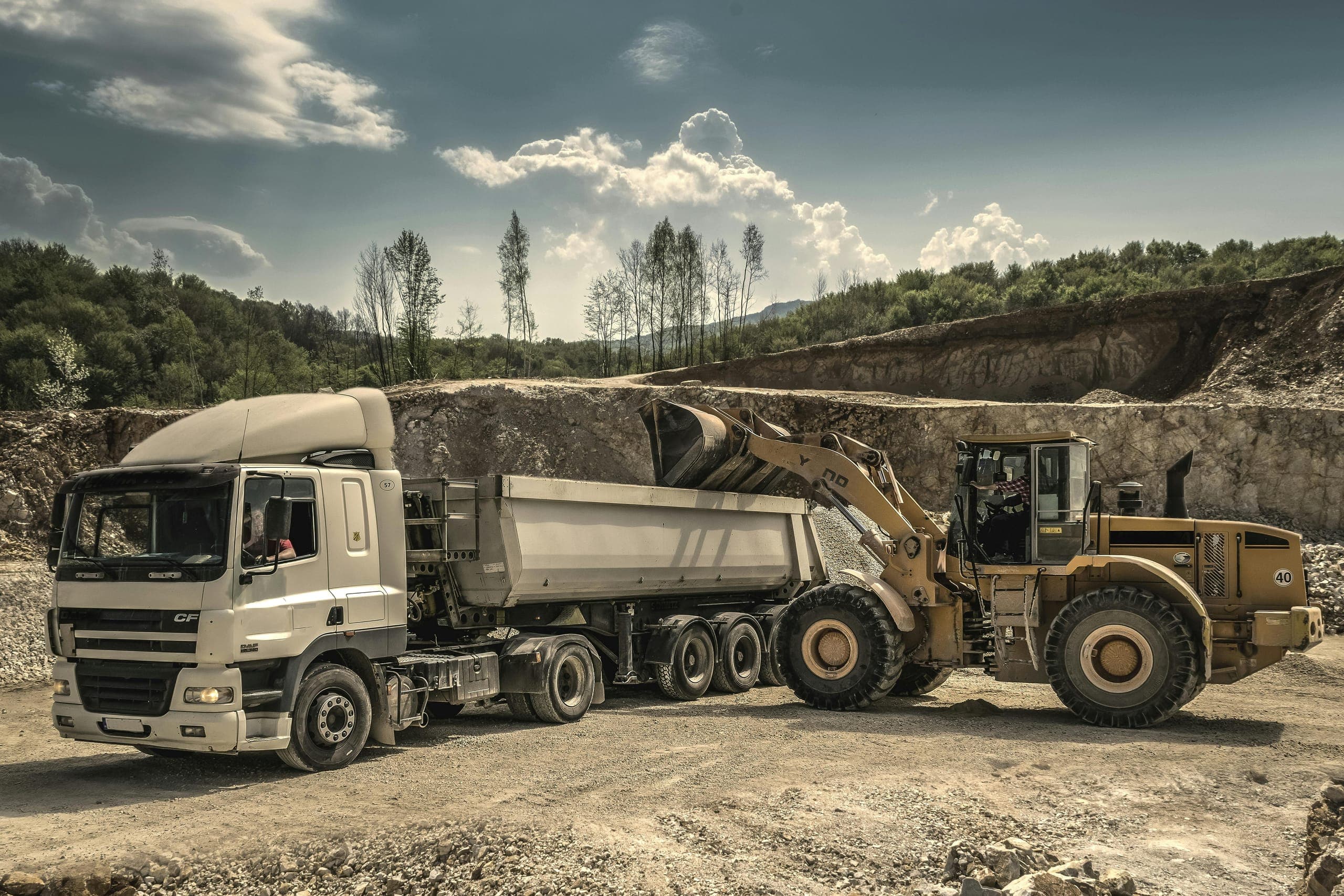 ARKK GROUP logistics operations with trucks being loaded